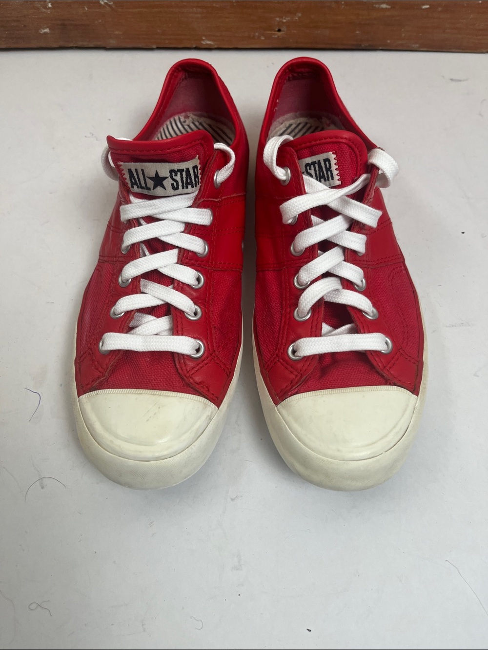 Red Converse Lady All Star Low-Top Leather Sneaker.